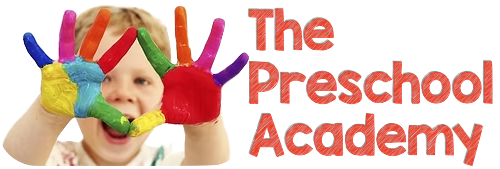 The image features a joyful toddler smiling while engaged in play, embodying the fun and learning environment at The Preschool Academy Inc. This visual highlights the academy's commitment to fostering a positive and interactive educational experience for young children.